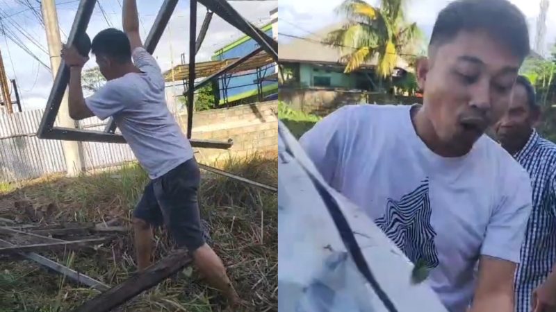 Karyawan Bank Sultra Cabang Molawe mengamuk dan merusak baliho bertuliskan kepemilikan tanah di lahan yang menjadi objek sengketa di Jl Buburanda, Kelurahan Korumba, Kecamatan Mandonga, Kota Kendari. (Foto: potongan video)